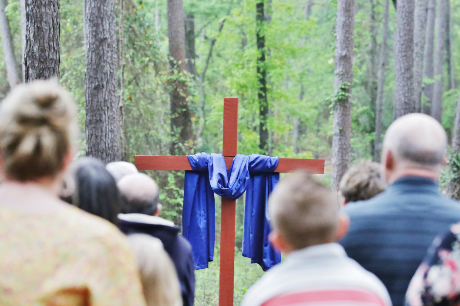 A purple robe draped over a cross symbolized the risen Christ.